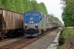 Carolinian passing a southbound grainer